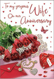 This richly detailed anniversary card feels like a cherished moment set out on a dressing table in a stylish Knightsbridge apartment, where every object has been chosen with care. At the centre, a small, lush cluster of red roses is arranged as if just placed down after delivery, their petals full and velvety, their deep crimson hue radiating warmth and affection. The blooms are interlaced with fresh, gleaming greenery, the leaves forming gentle arcs that cradle the flowers and add dimension, evoking the natural elegance of a hand-tied bouquet. To one side, an envelope lies ready, its clean lines and smooth paper suggesting a personal message hidden inside, while a piece of jewellery-perhaps a fine necklace or delicate charm-rests nearby, its metallic surface catching the light in slender, sparkling threads. A heart-shaped box, finished in a striking red tone, anchors the composition with a sense of sentiment and keepsake value, as if it once held a proposal ring or a beloved gift. Around these focal pieces, small red hearts are scattered like confetti, their playful presence exaggerated by the soft glow that washes over the scene. A single, light-winged butterfly motif dances among them on the card design, suggesting transformation and the ongoing growth of love through the years. The overall palette of crimson, ivory, and gentle green, set against a subtly shimmering surface, creates an atmosphere that is both romantic and refined-a perfect visual echo of an anniversary spent wandering the elegant streets near Harrods or sharing a quiet evening together at home.